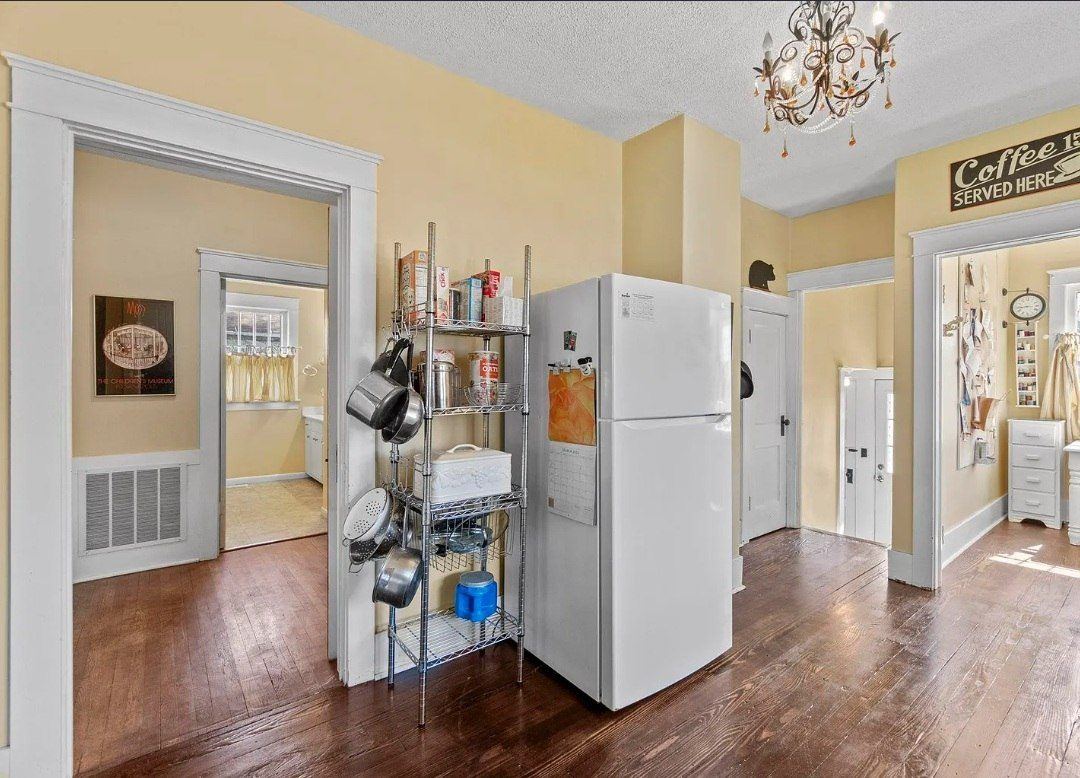 Kitchen before — wire shelving and yellow walls