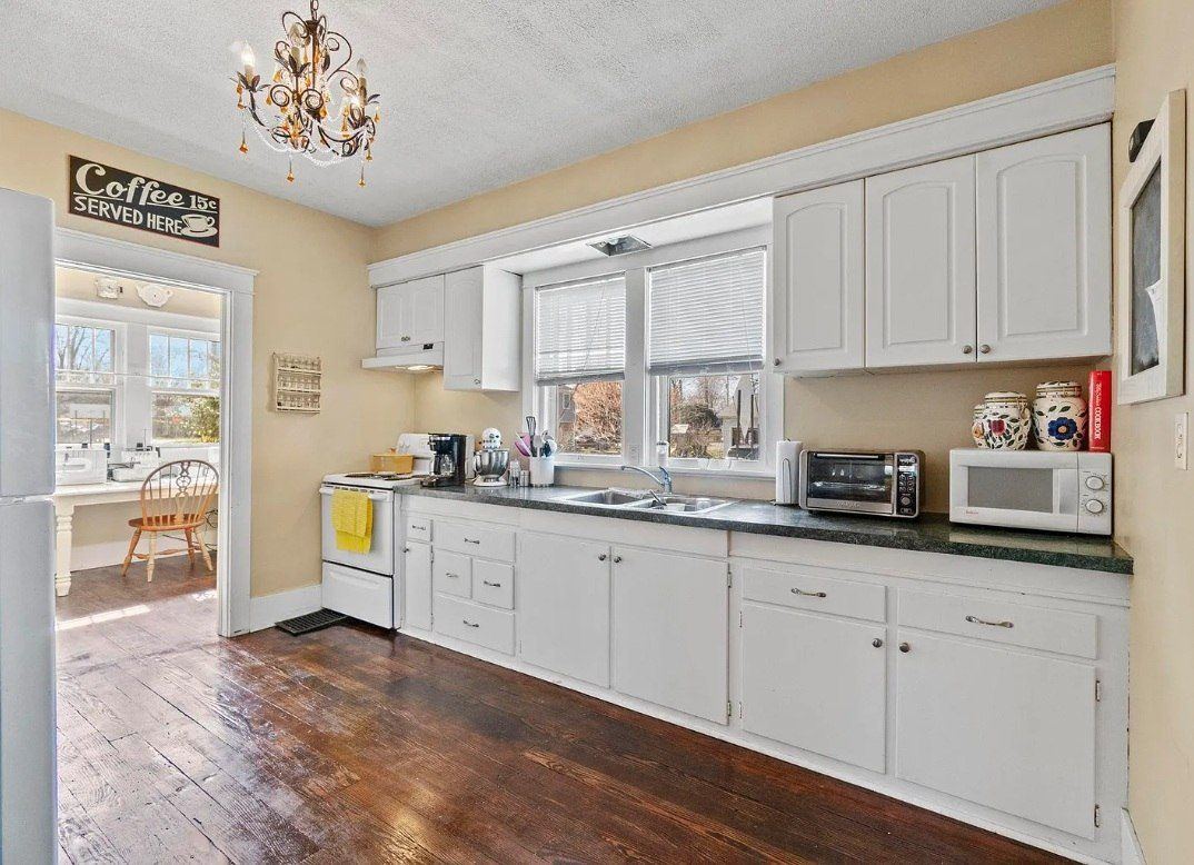 Zelmanovich kitchen before — dated layout, yellow walls, no storage